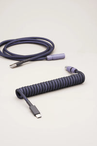 Coiled dark purple keyboard cable